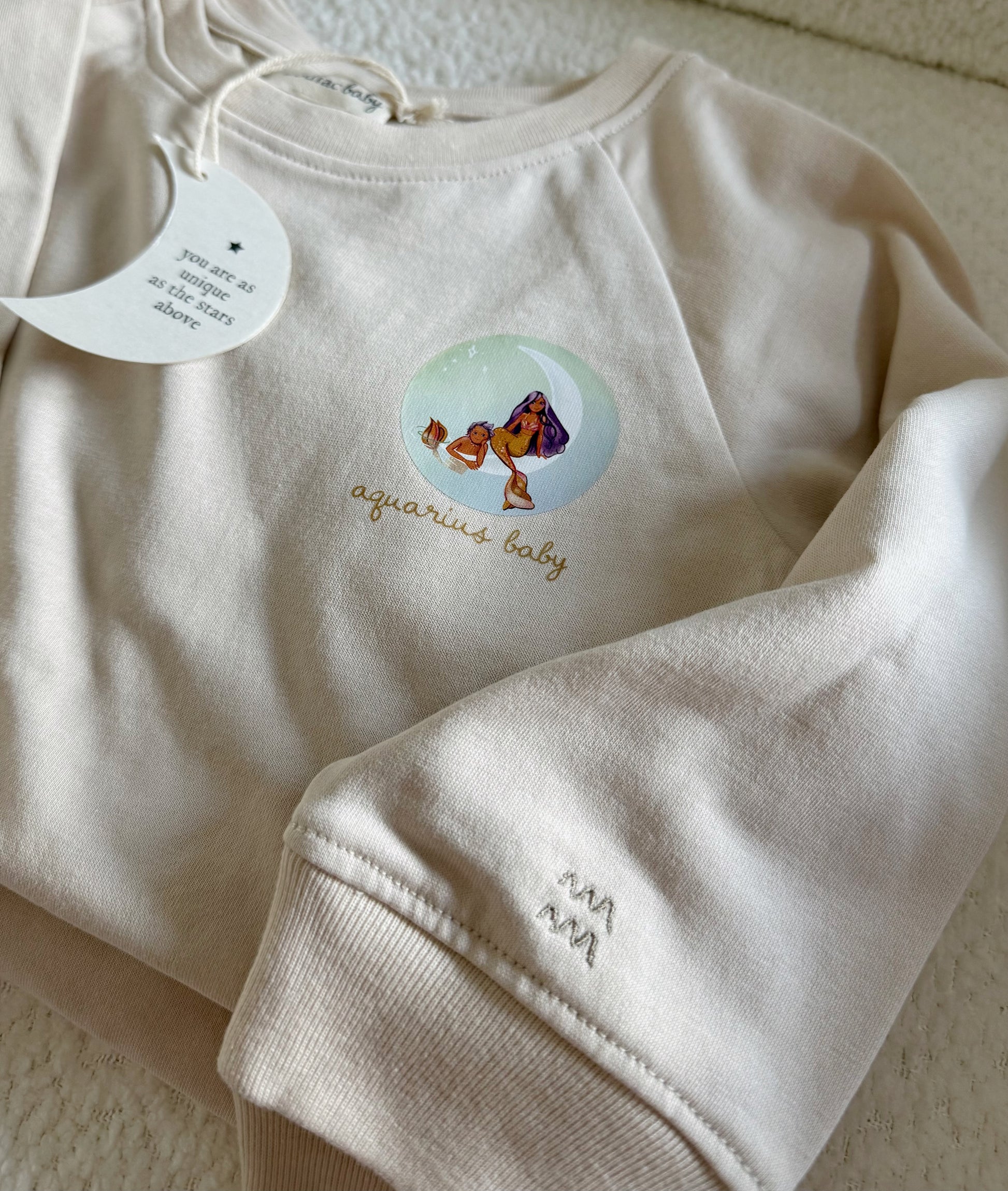 Beige Aquarius zodiac crewneck sweatshirt for toddlers and babies