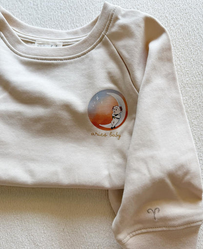 Beige Aries ram zodiac crewneck sweatshirt for toddlers and babies
