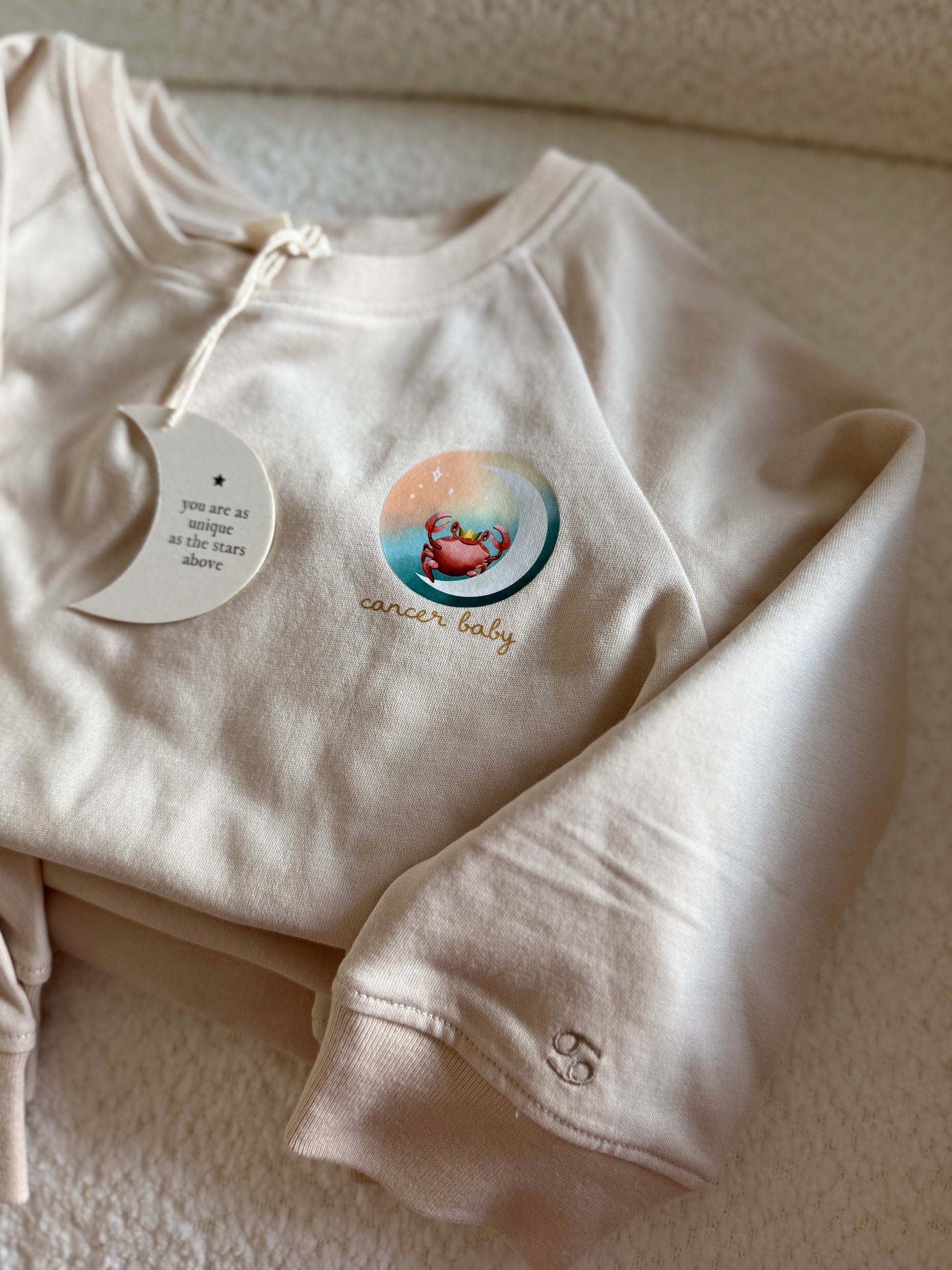Beige Cancer zodiac crewneck sweatshirt for toddlers and babies