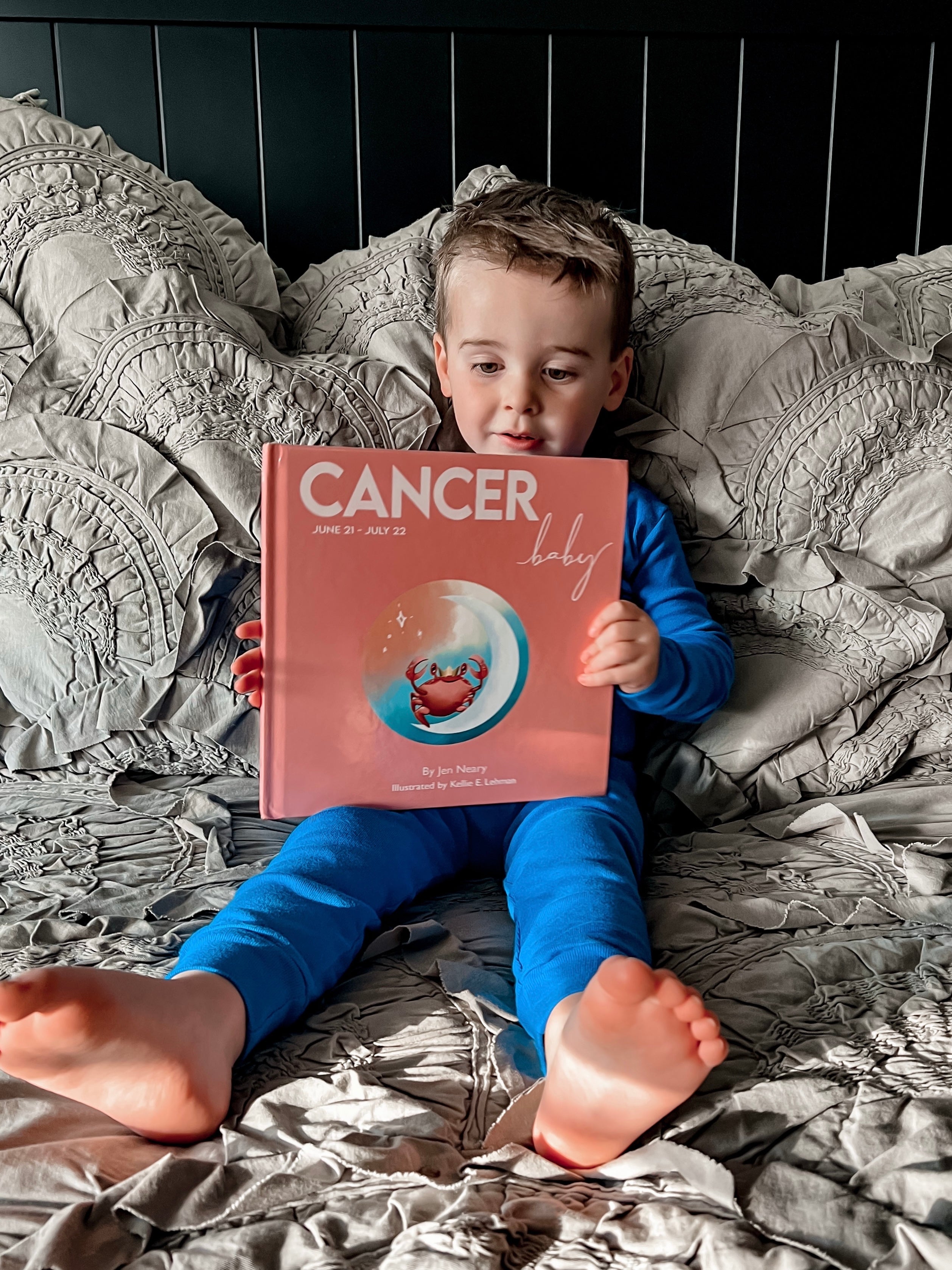 Cancer zodiac baby book featuring a crab who lives in the ocean.