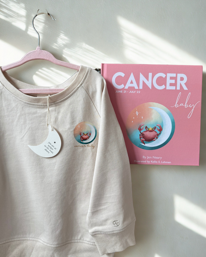 cancer zodiac book and matching toddler crewneck featuring a crab and moon for a unique and meaningful baby shower gift