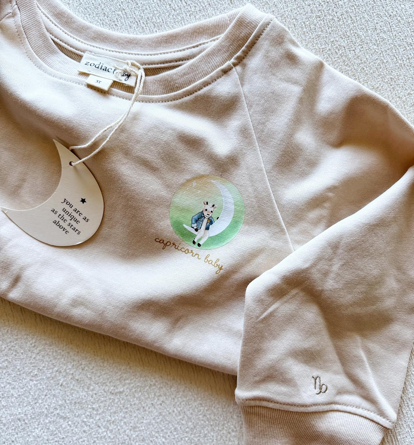 Beige Capricorn goat zodiac crewneck sweatshirt for toddlers and babies