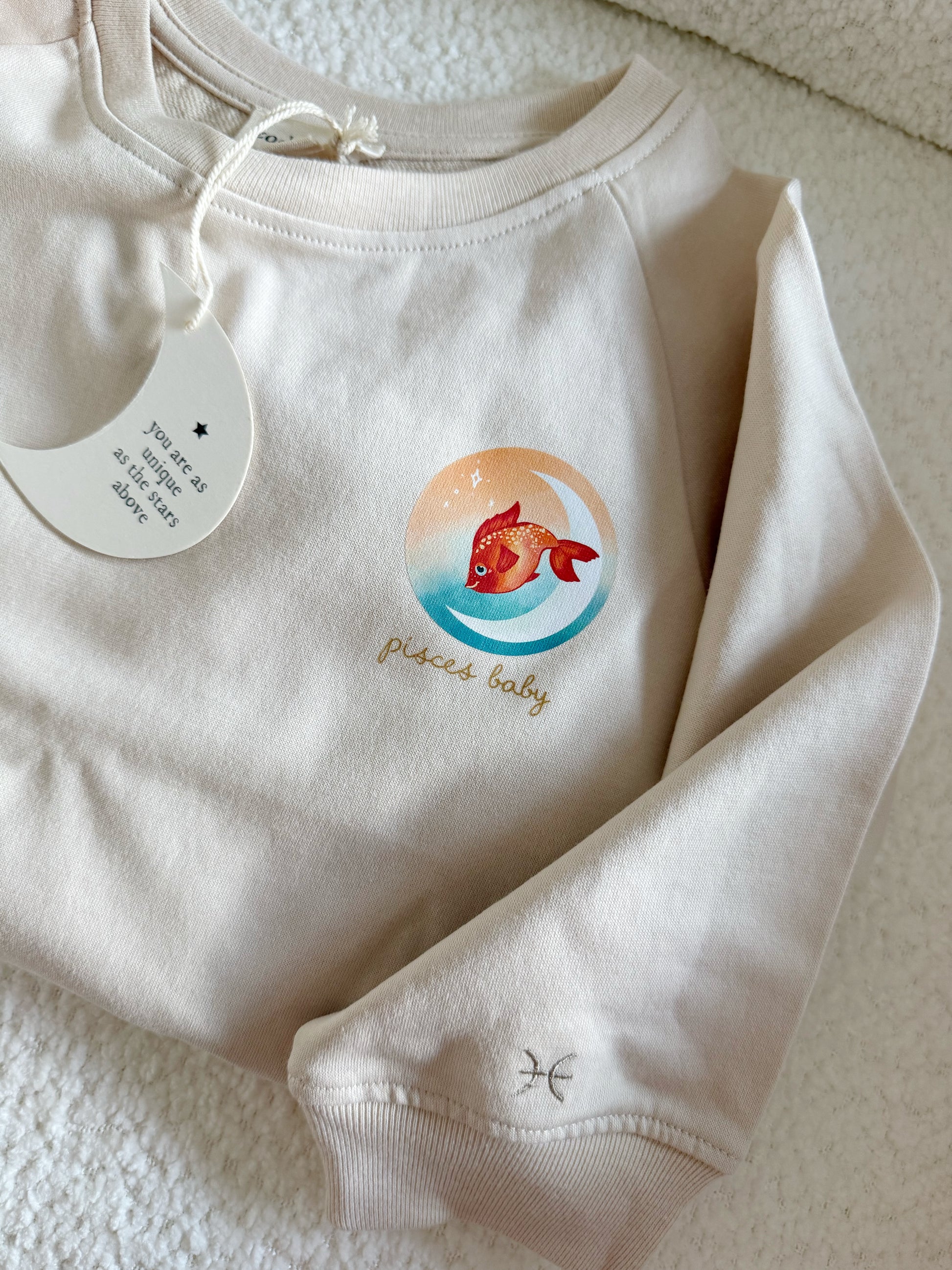 Beige Pisces fish zodiac crewneck sweatshirt for toddlers and babies